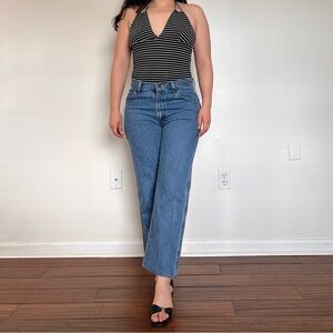 Vintage Rustler Mid-waist Medium Wash jeans with a straight leg fit. Size: 31”